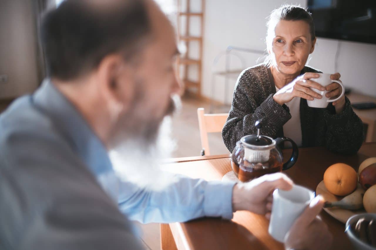 Older couple enjoying coffee together.