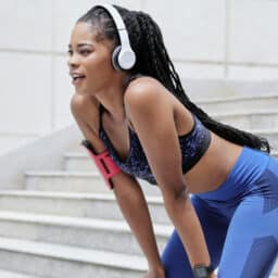 Woman exercises with headphones
