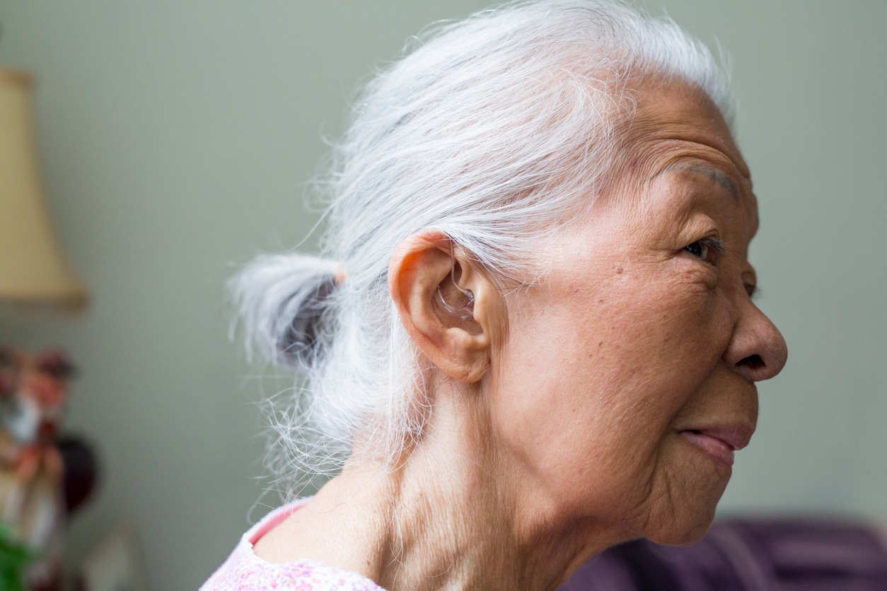 Woman wears hearing aid