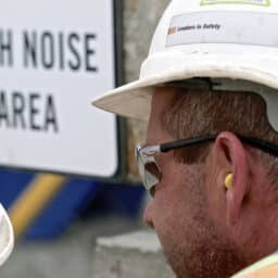 Man wears hearing protection at work