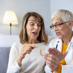 Woman talking to her audiologist about her hearing aid