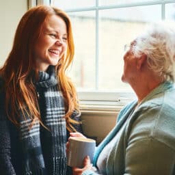 Young woman talking to her mother.