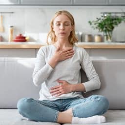 Woman practicing calming breaths